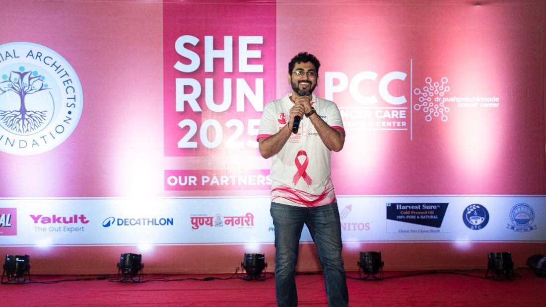 The main stage and partner wall at She Run 2025.